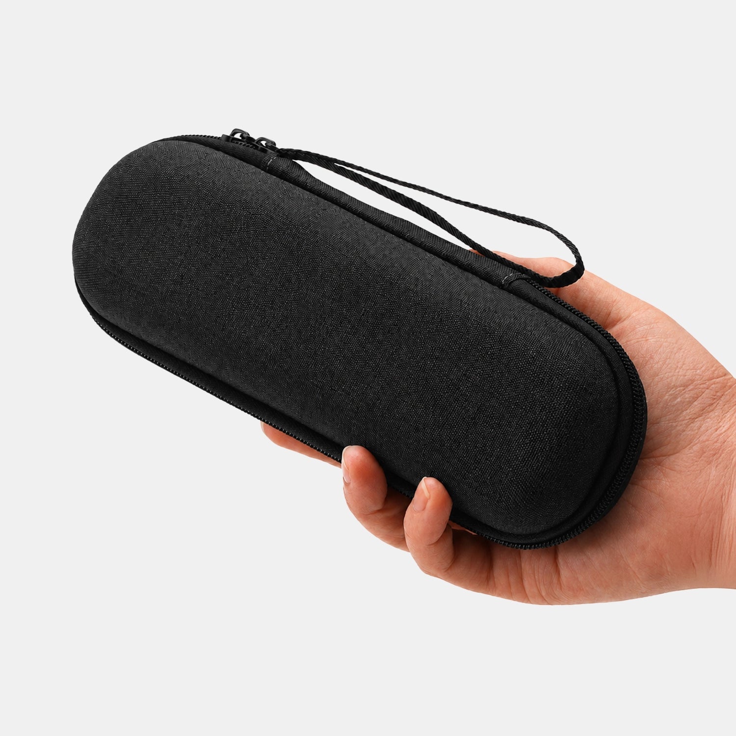 The Pepkase Travel Case held in hand to show scale and portability